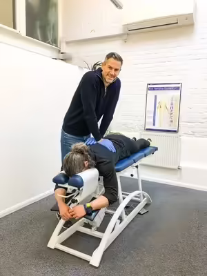 Chiro London chiropractor speaking with a corporate team