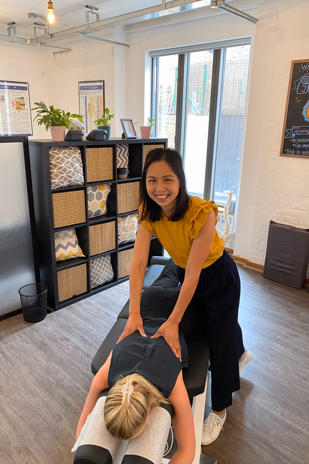 Chiropractor treating a patient on a bench